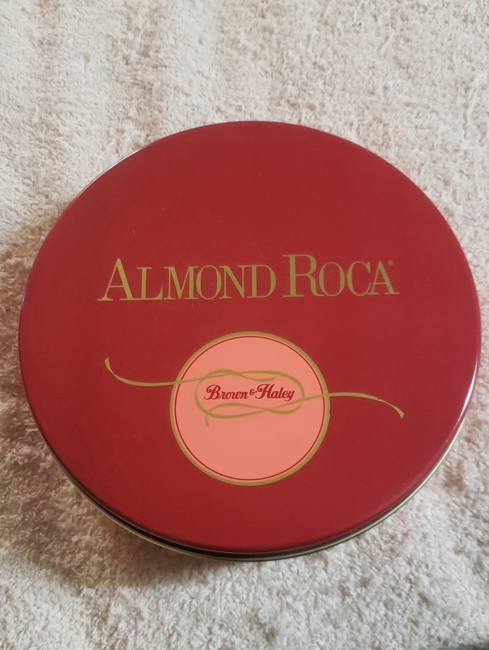 Decorative Almond Roca Red And Pink Tin by Brown & Haley
